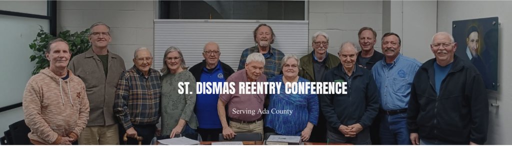 Group photo of 13 members of the St. Dismas Reentry Conference